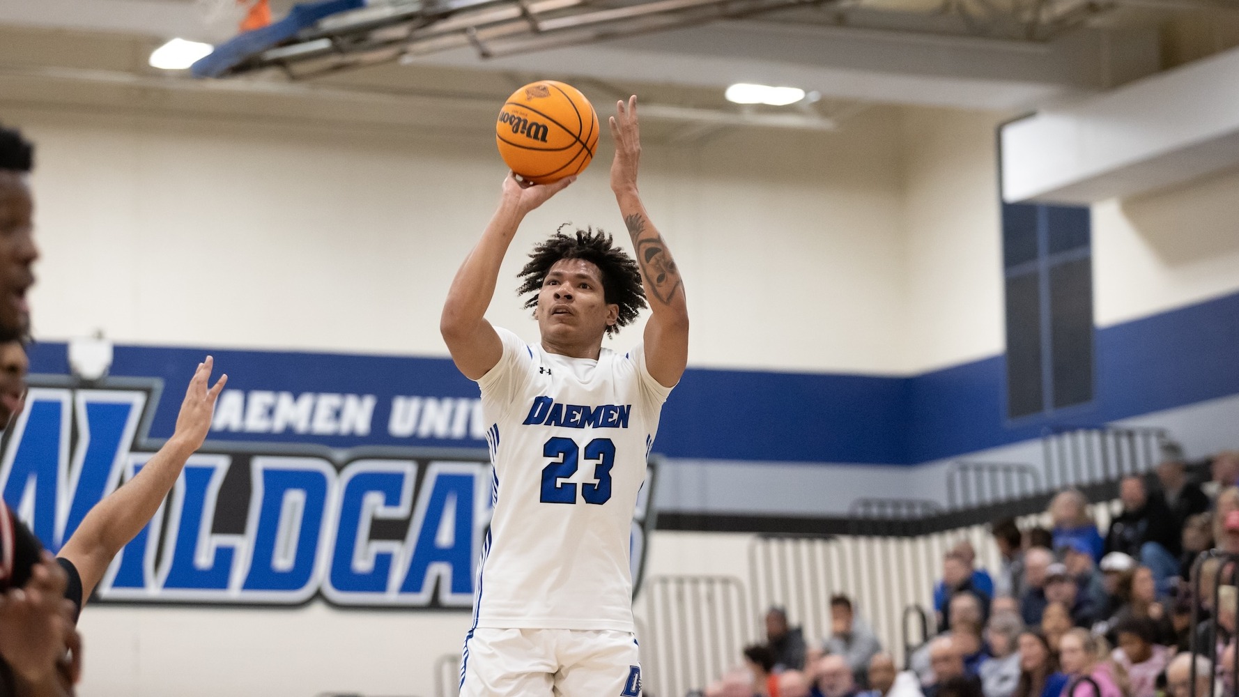 Justin Hemphill shoots a ball