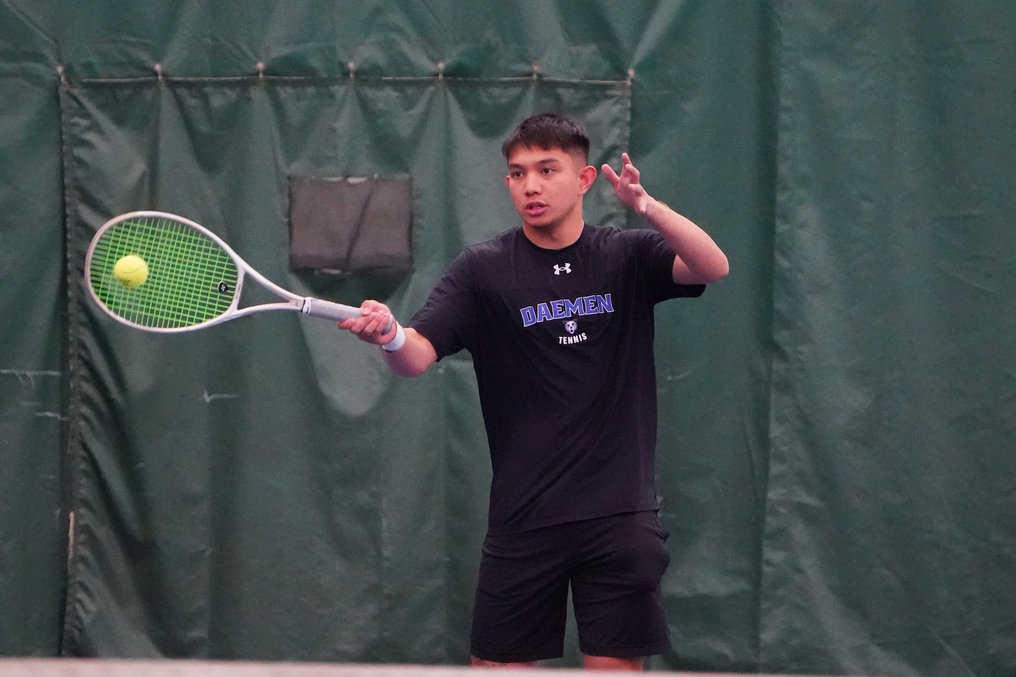 Alex Lumanog connects with a ball 