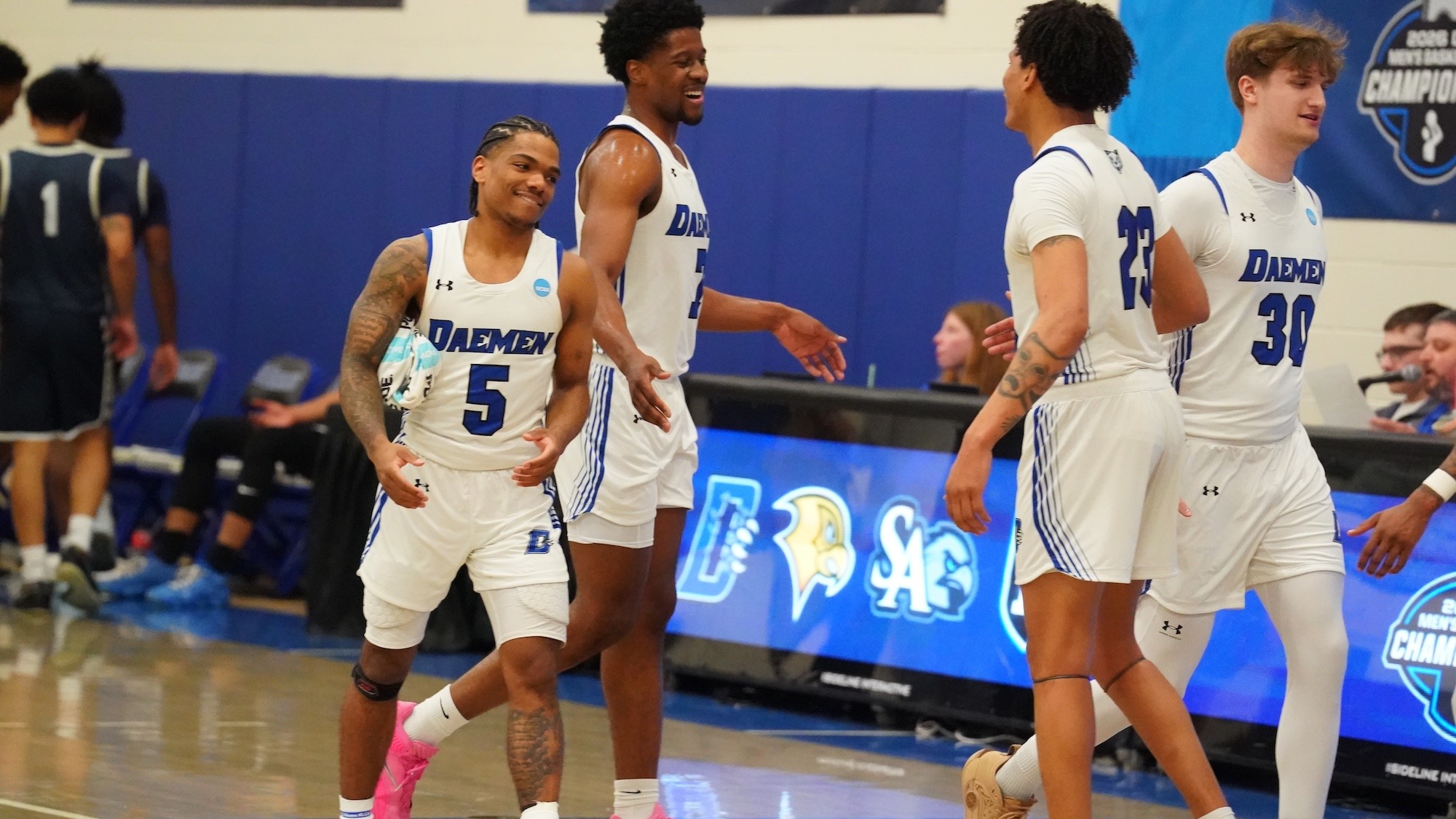 Glover, Nwugwo and Hemphill high five