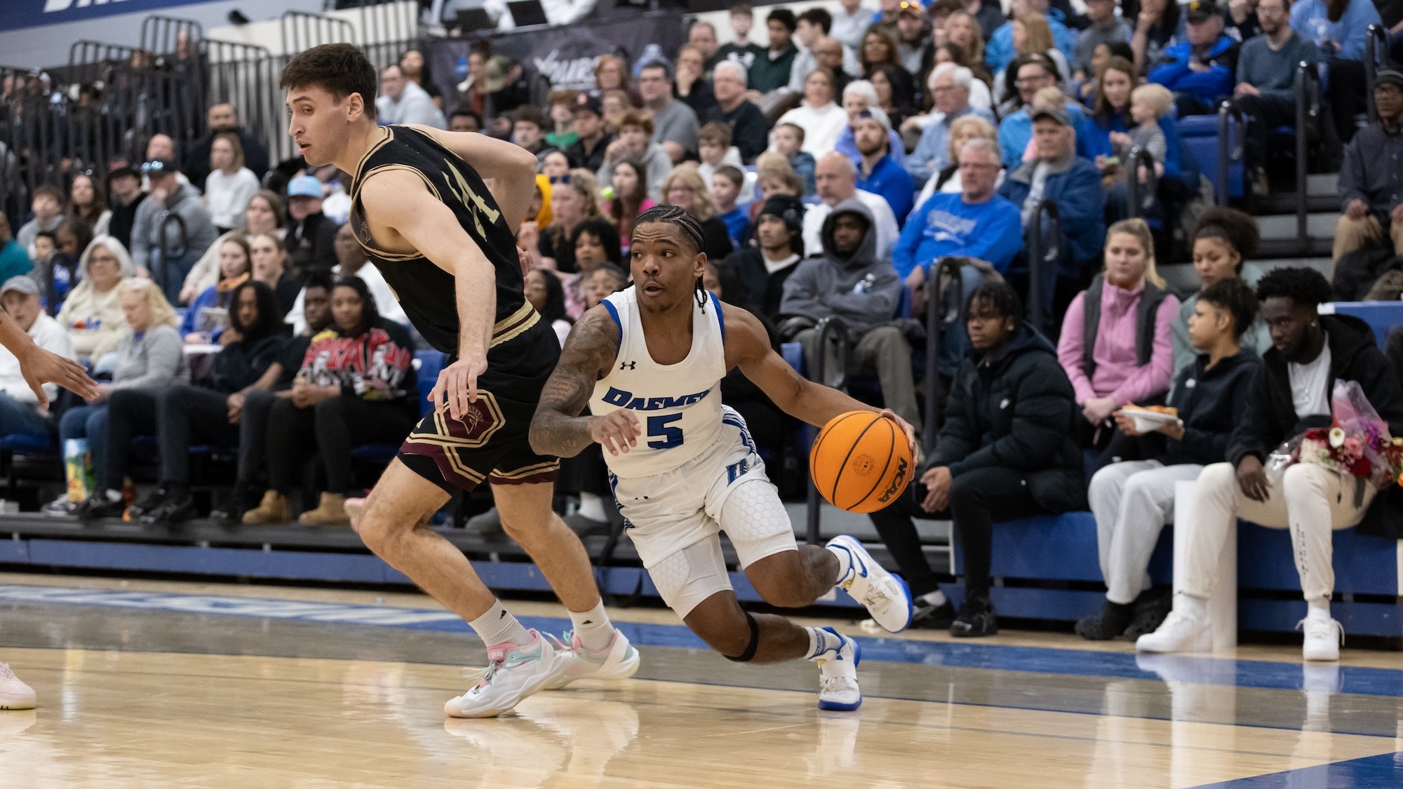 Justin Glover dribbles around STAC defender