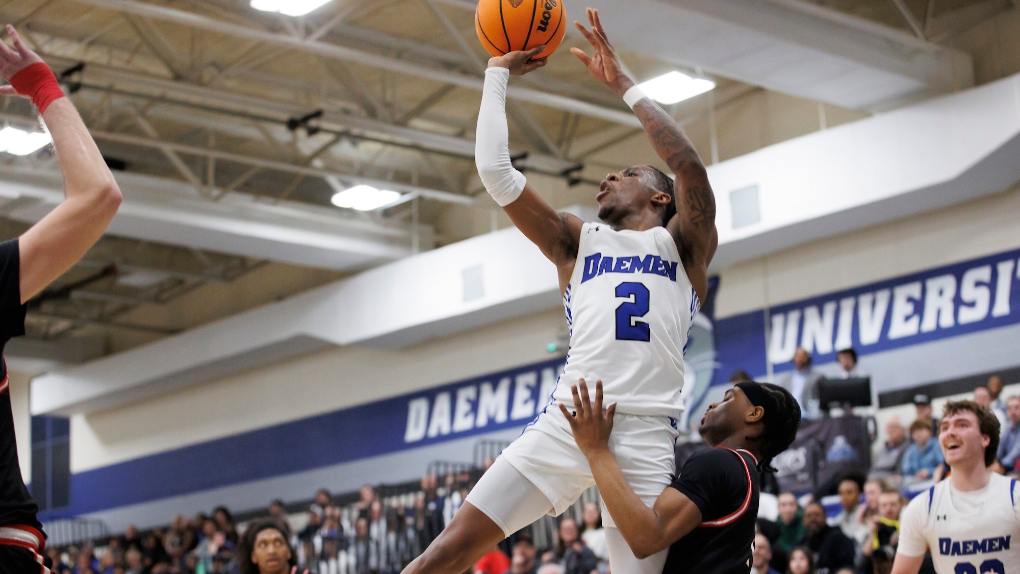 Ryan Heath goes for the layup against D'Youville