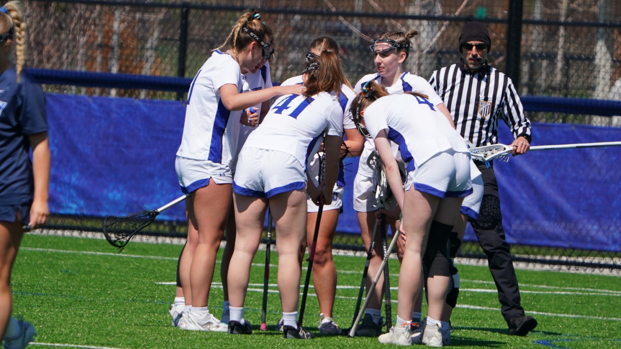 Women's lacrosse group huddle