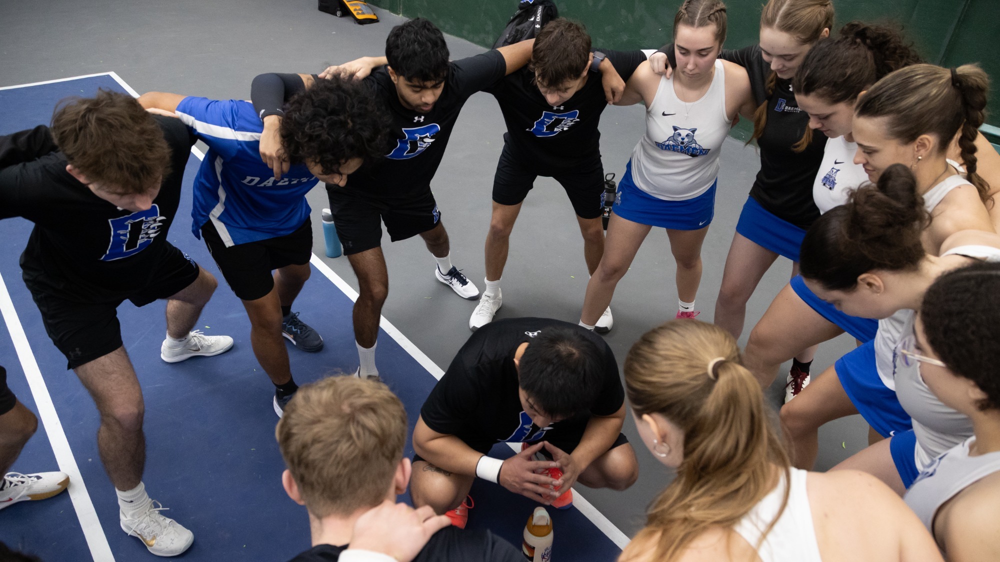 Men's/women's tennis huddles before match