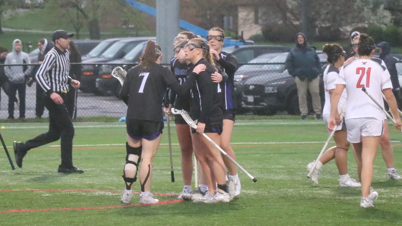Women's lacrosse group huddle