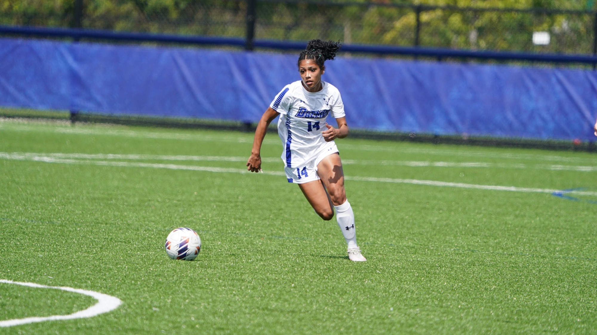 Mia Wright dribbles