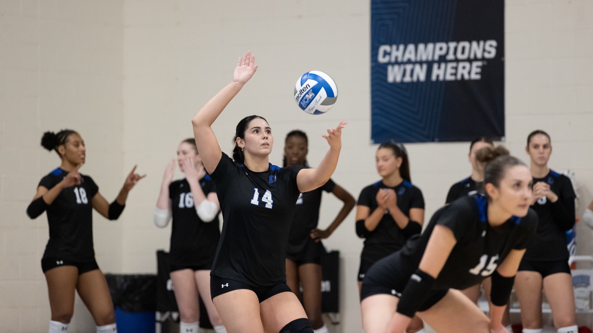 Amelia Gonzalez serves against St. Michael's