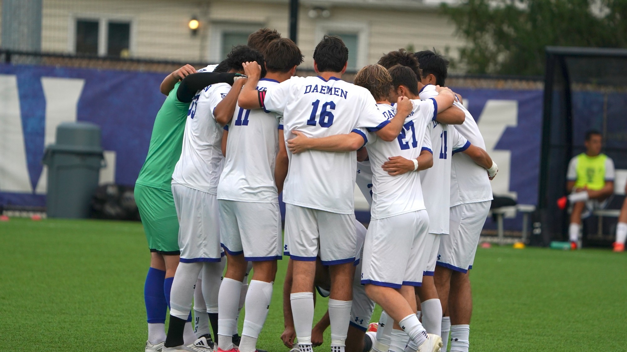 Men's soccer team huddle