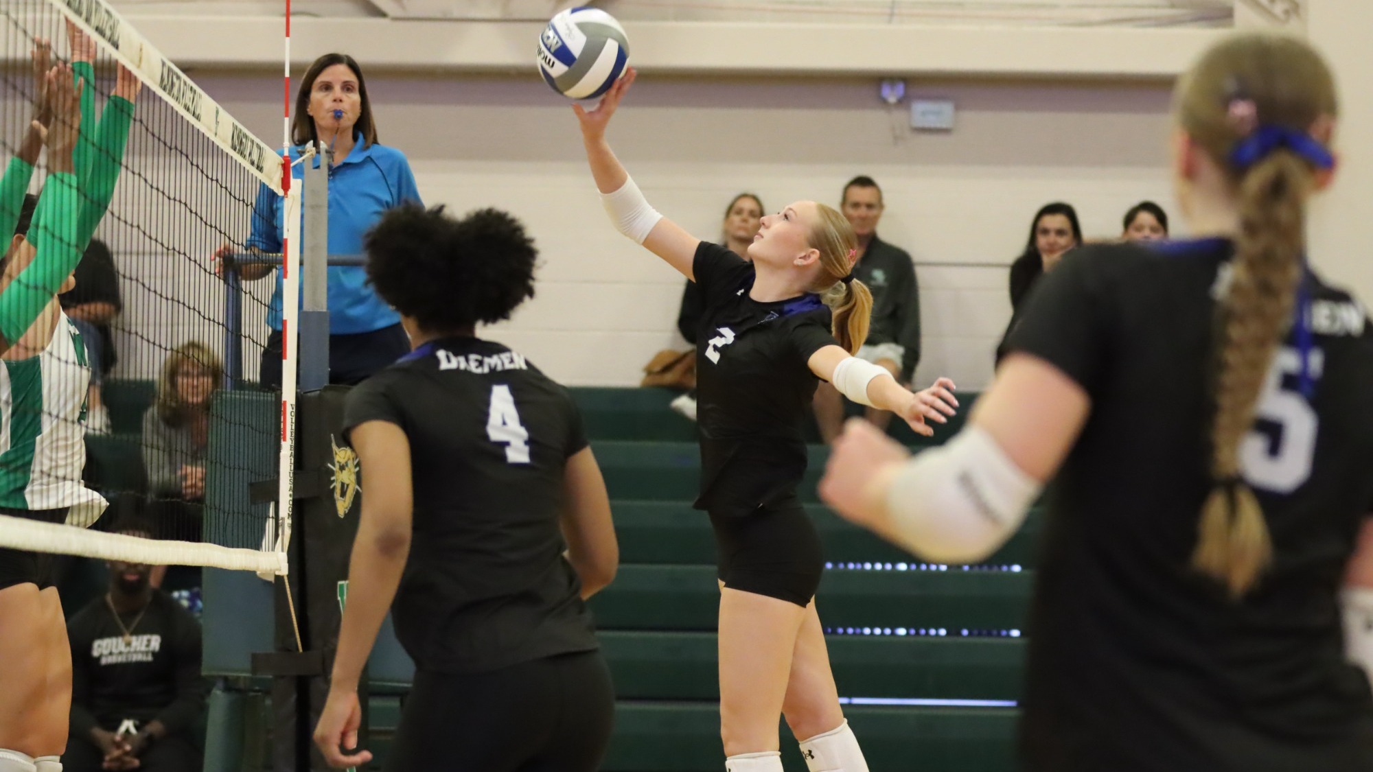 Dayden Dyess taps a ball over