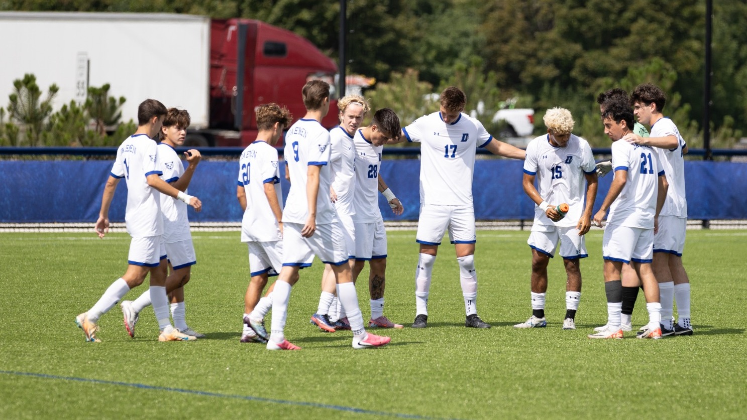 Men's soccer pre-game huddle