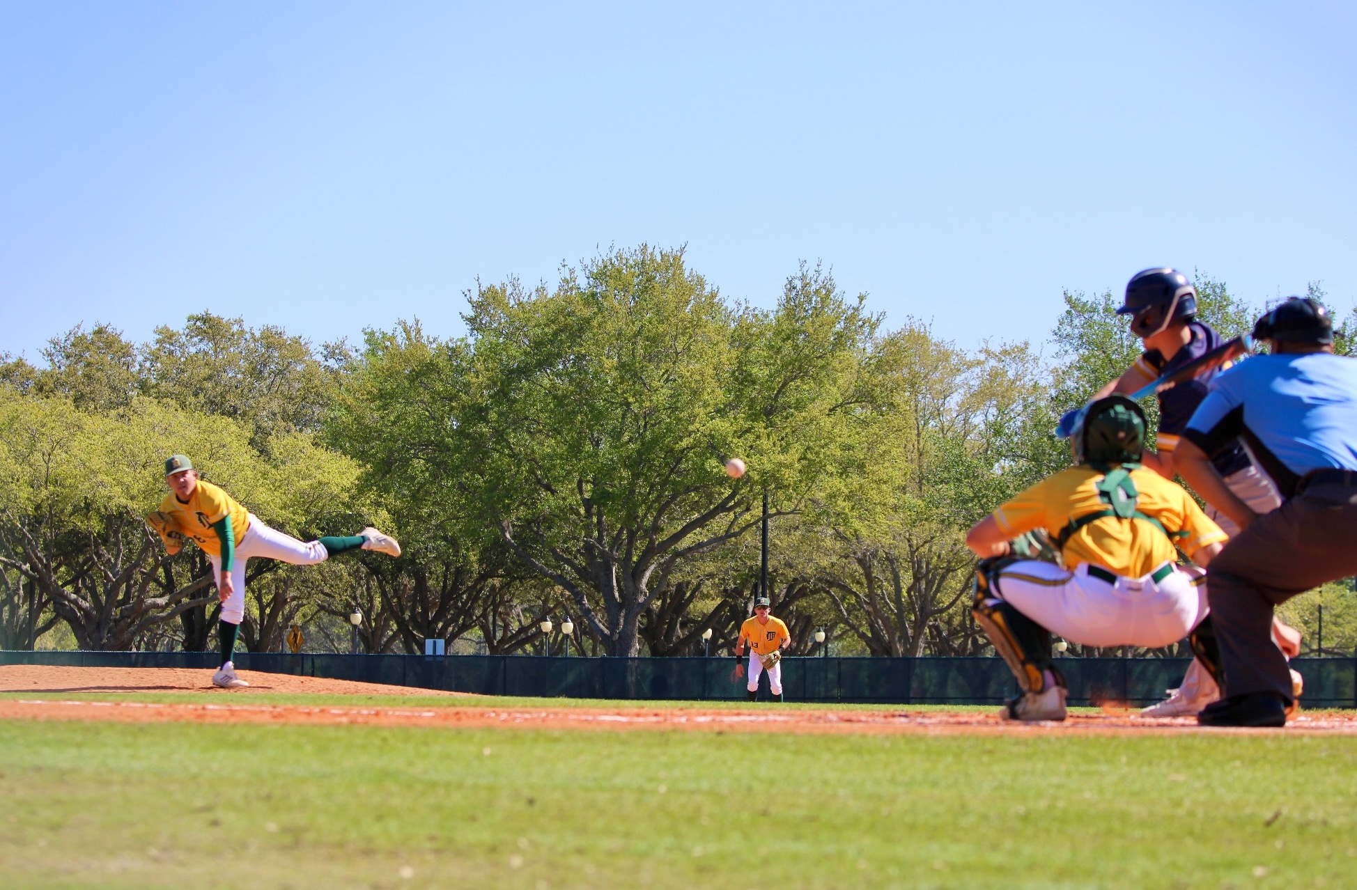 Delgado pitcher throwing off mound to batter with catcher and umpire