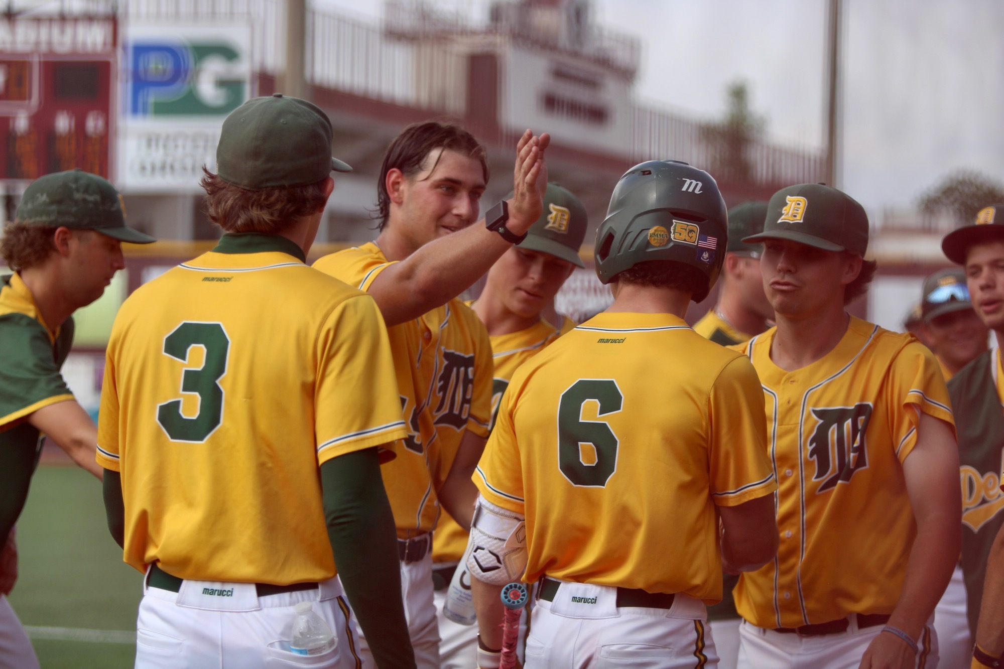 Delgado players celebrate a homerun