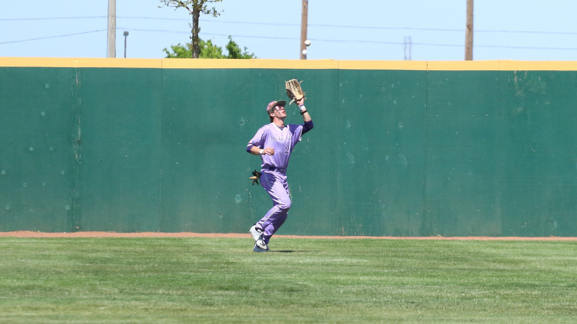 Dodge City CC baseball player, Hunter Morgan grabs fly ball in the outfield against Garden City. 
