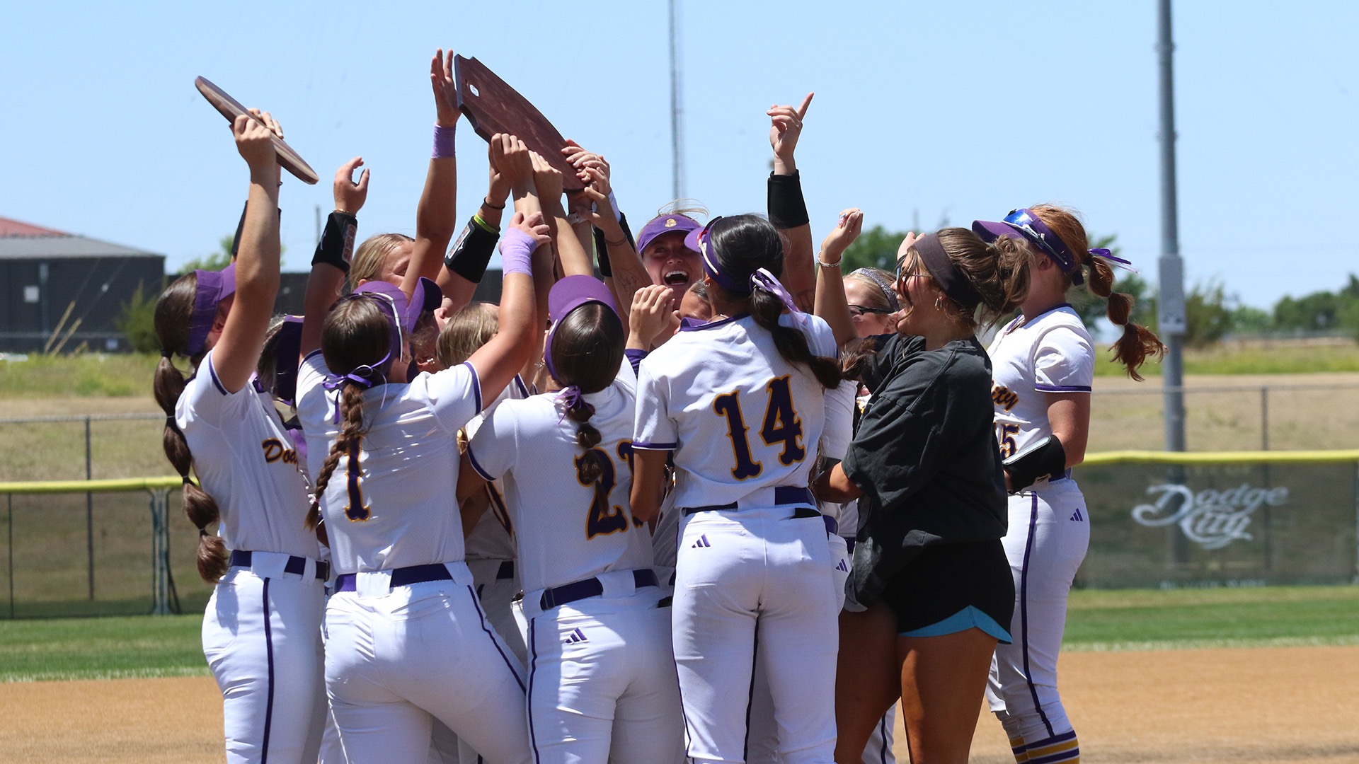 Dodge City CC Softball team celebrates winning the Region 6 and Plains District titles. 