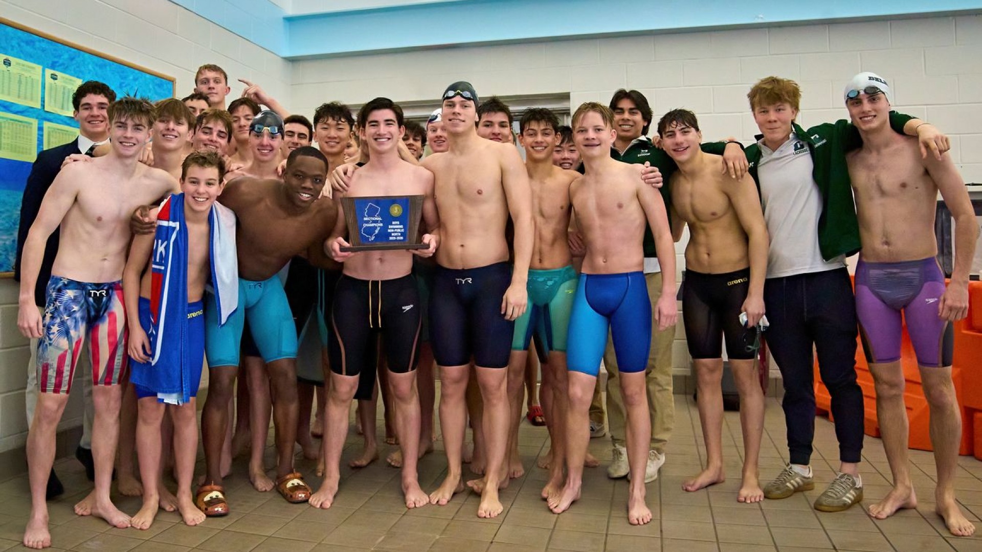 swimming team celebrates title