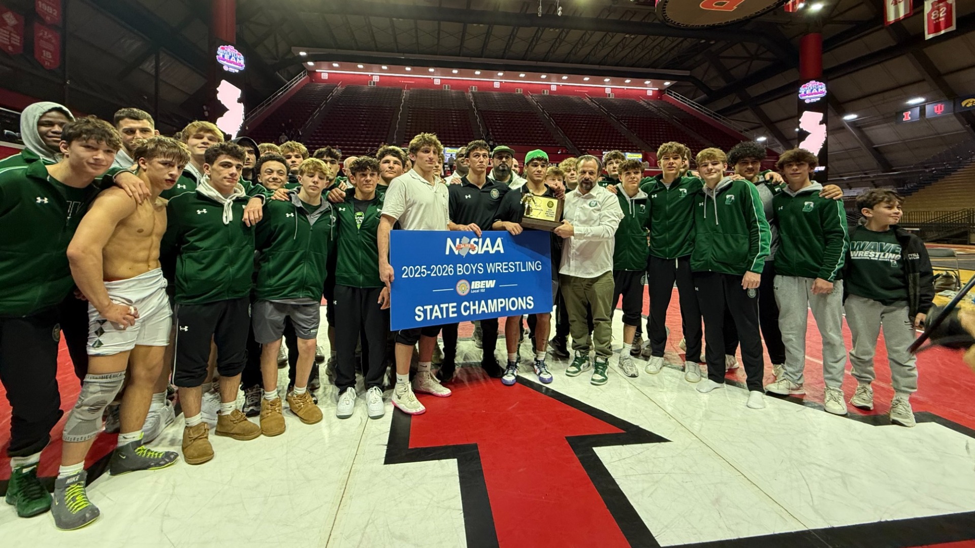 delbarton team celebrates with trophy