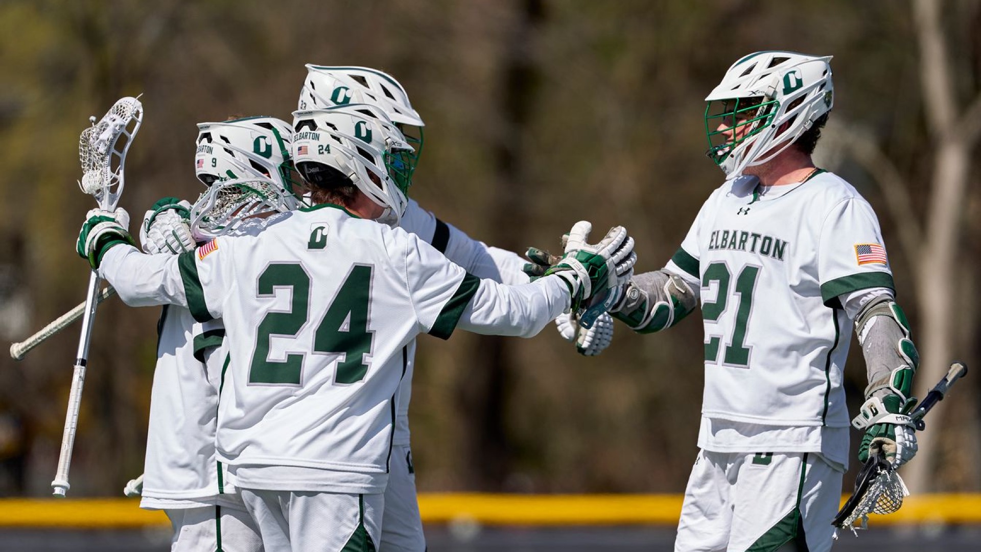 lax team celebrates goal