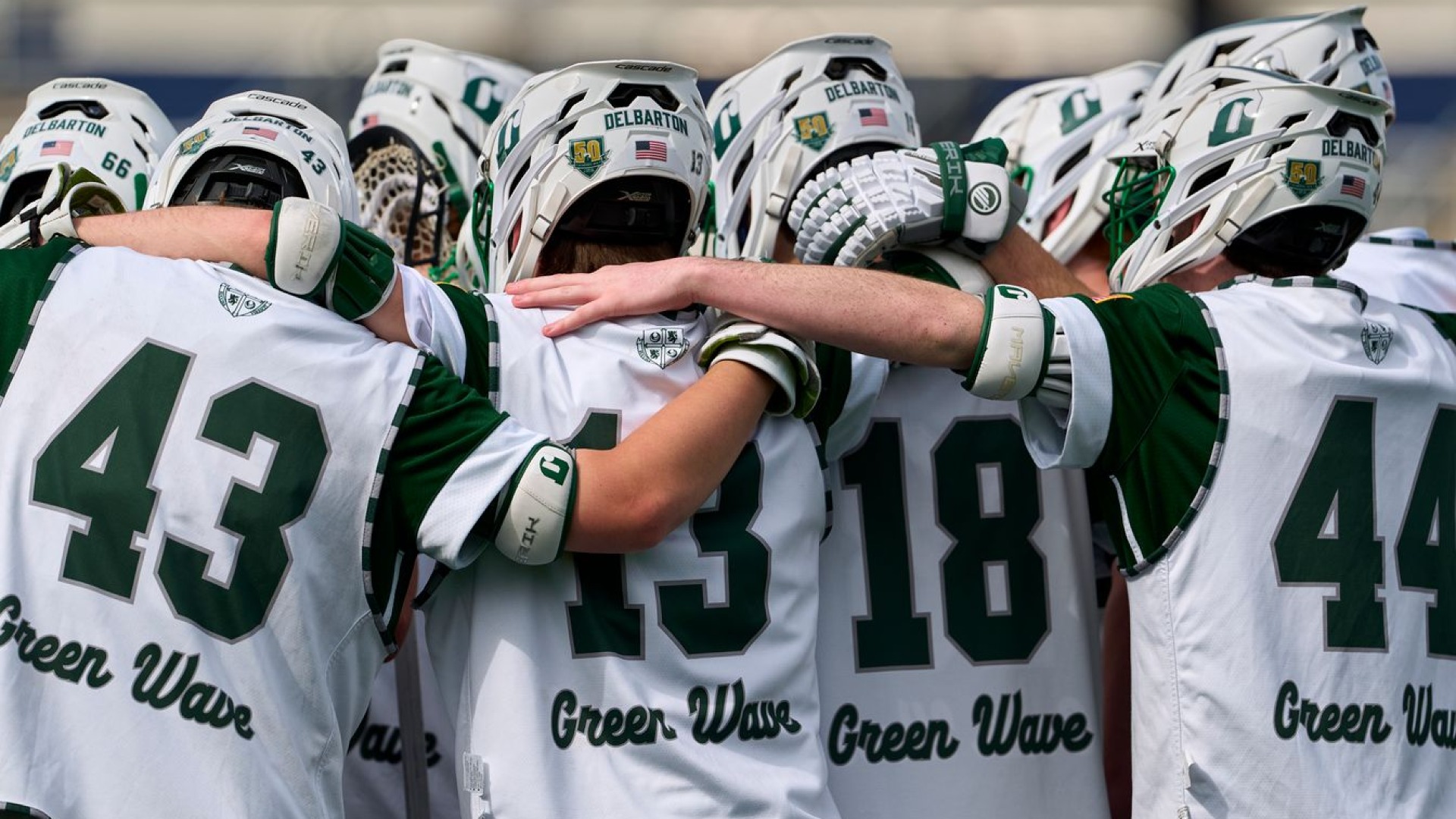delbarton team huddles together