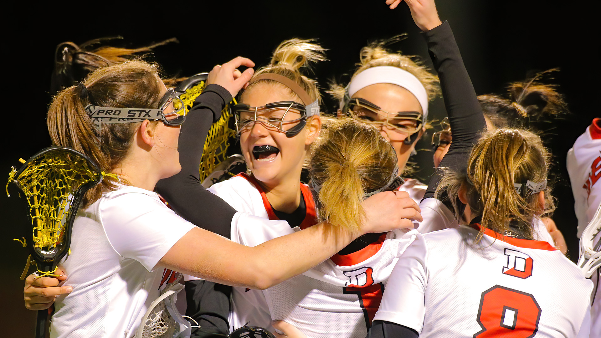 Denison lacrosse celebrates