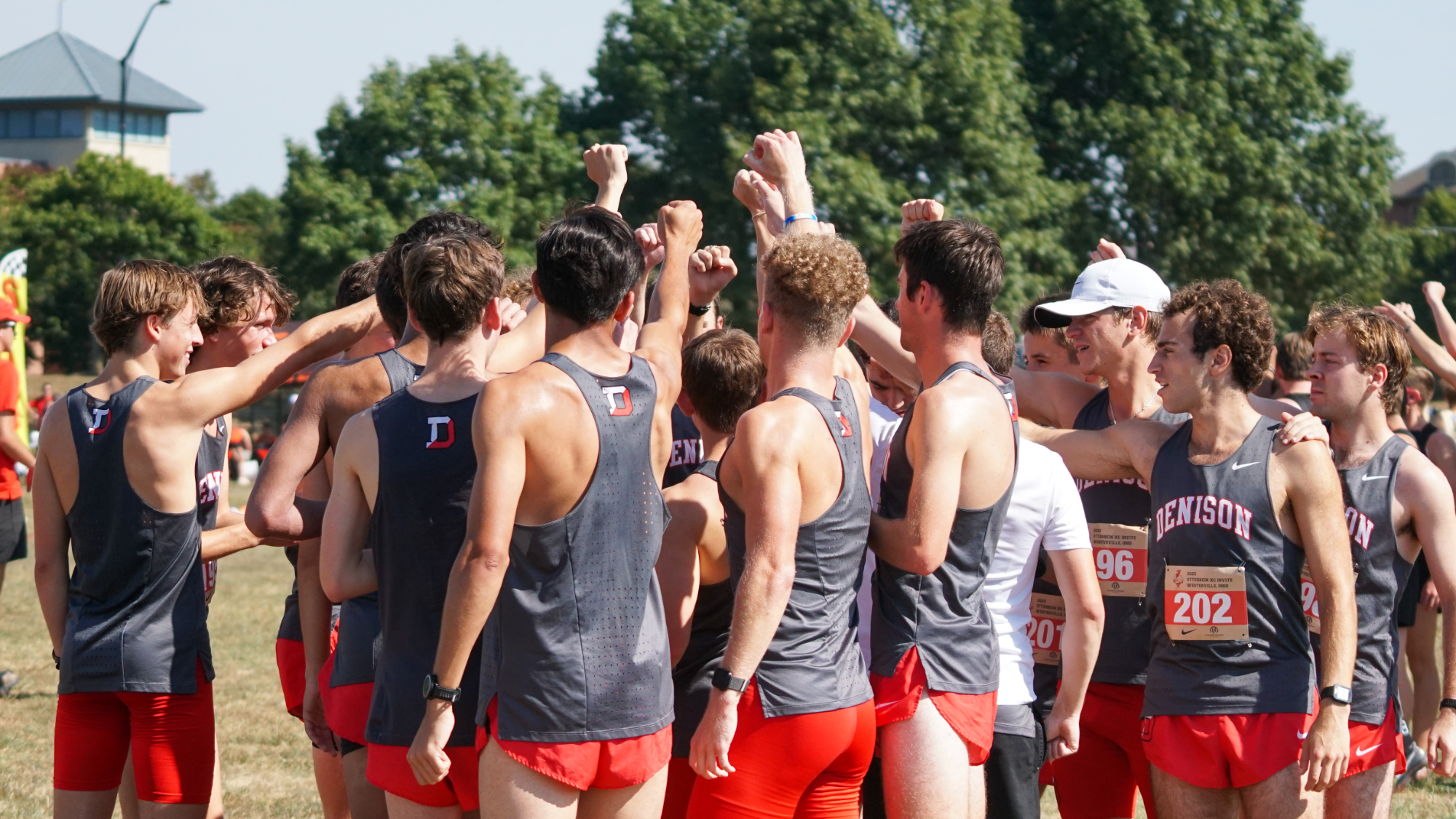 Men's XC cheering before a meet