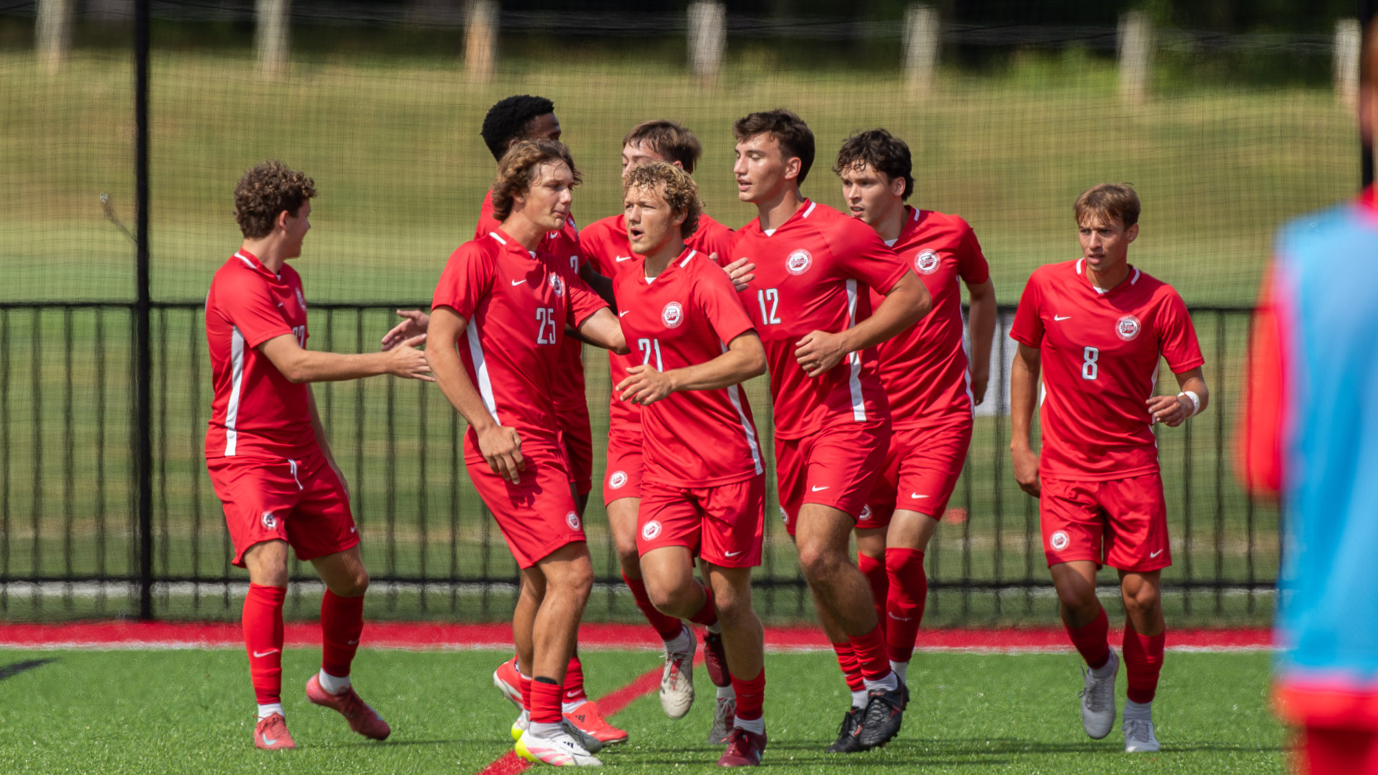 Men's soccer celebration