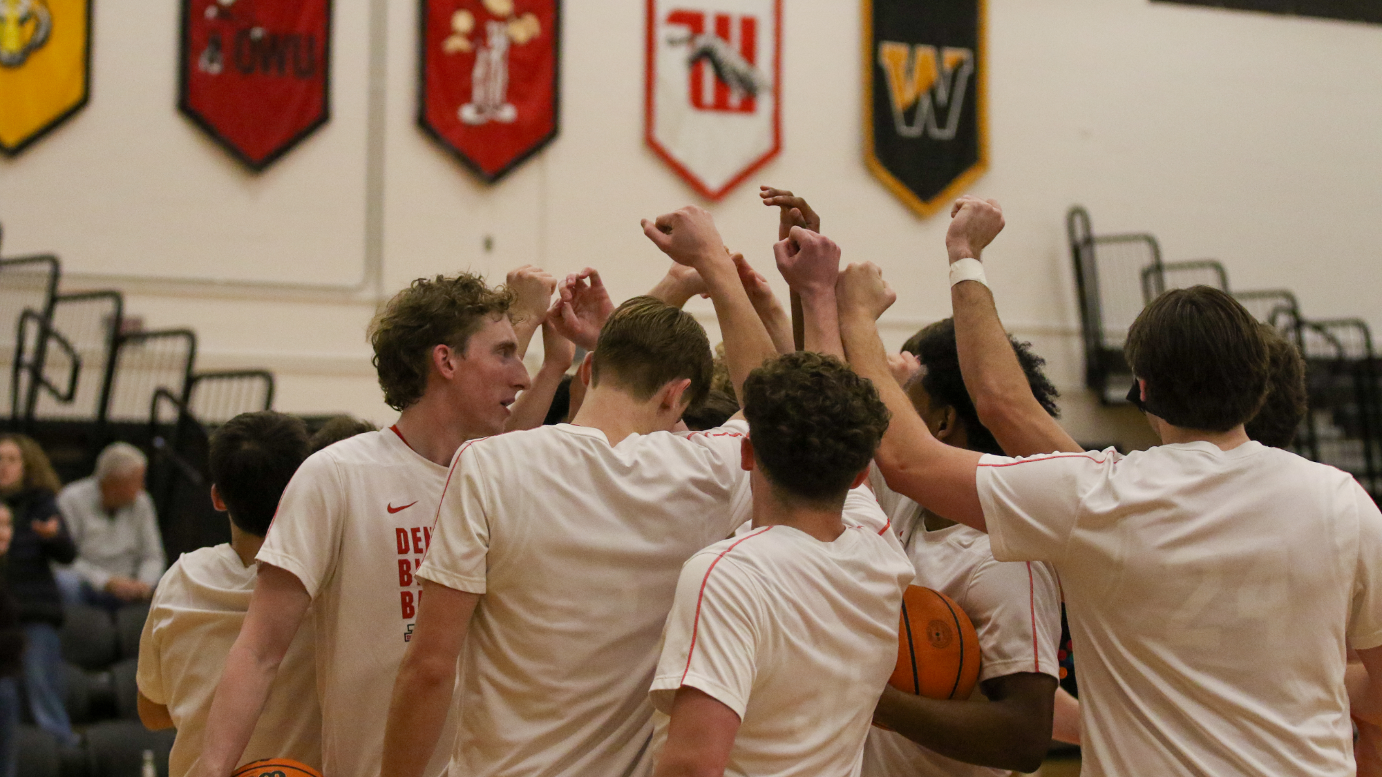 Denison men's basketball huddle