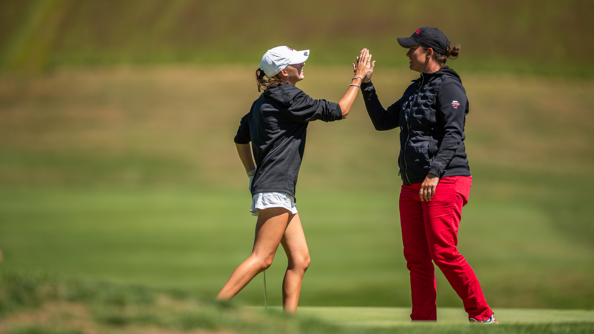 Women's golf coach celebration