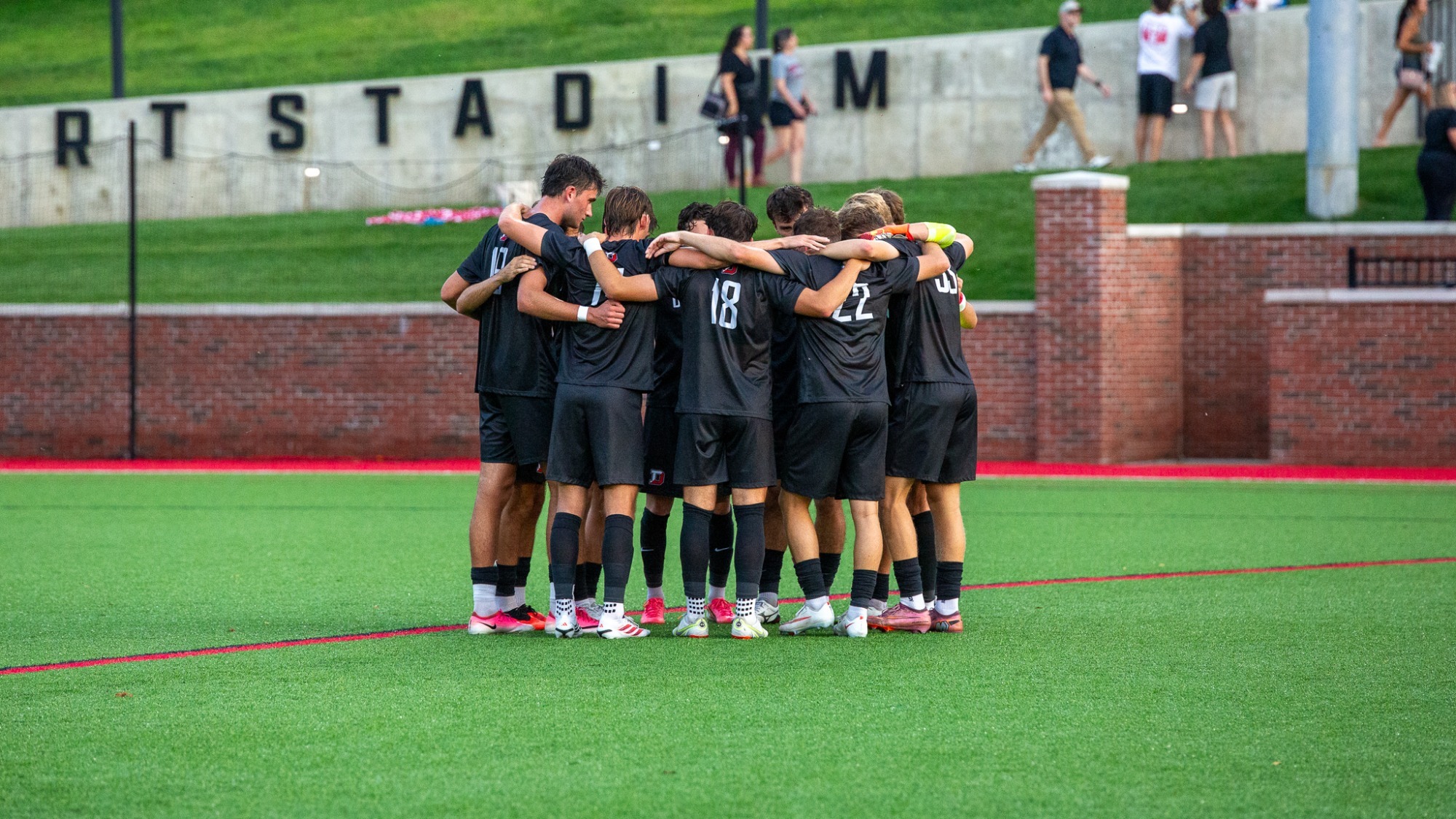 Men's soccer huddle