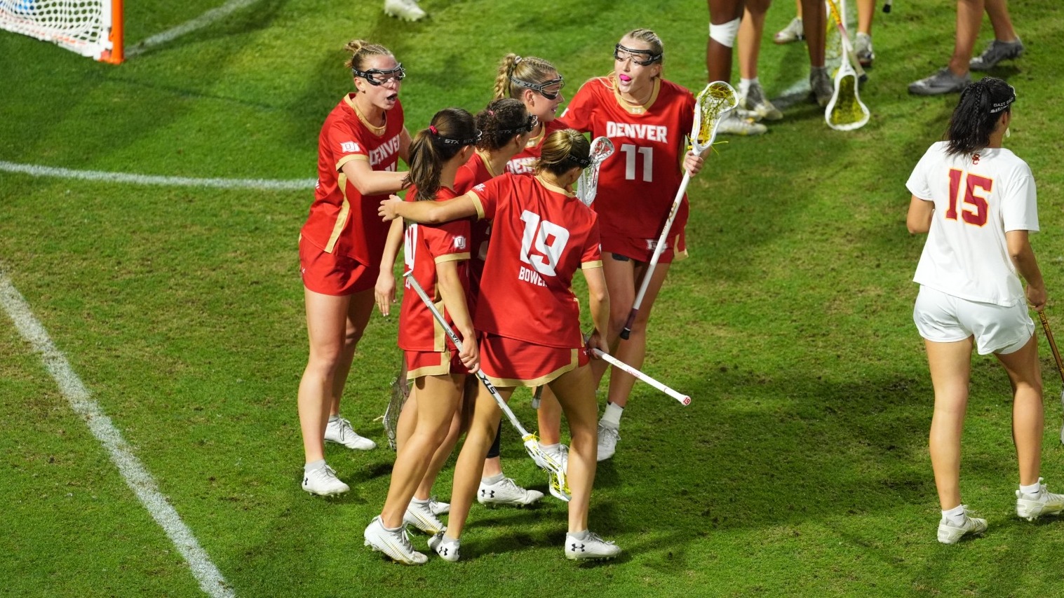 Denver women's lacrosse celebrates a goal vs. USC