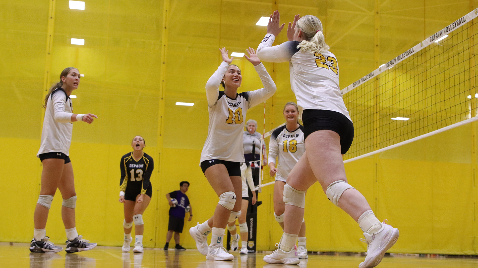 DePauw volleyball celebration