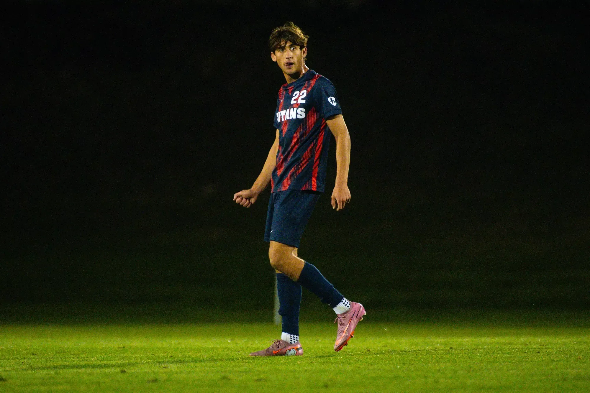 Johnny Strickler, sophomore midfielder, looks on.