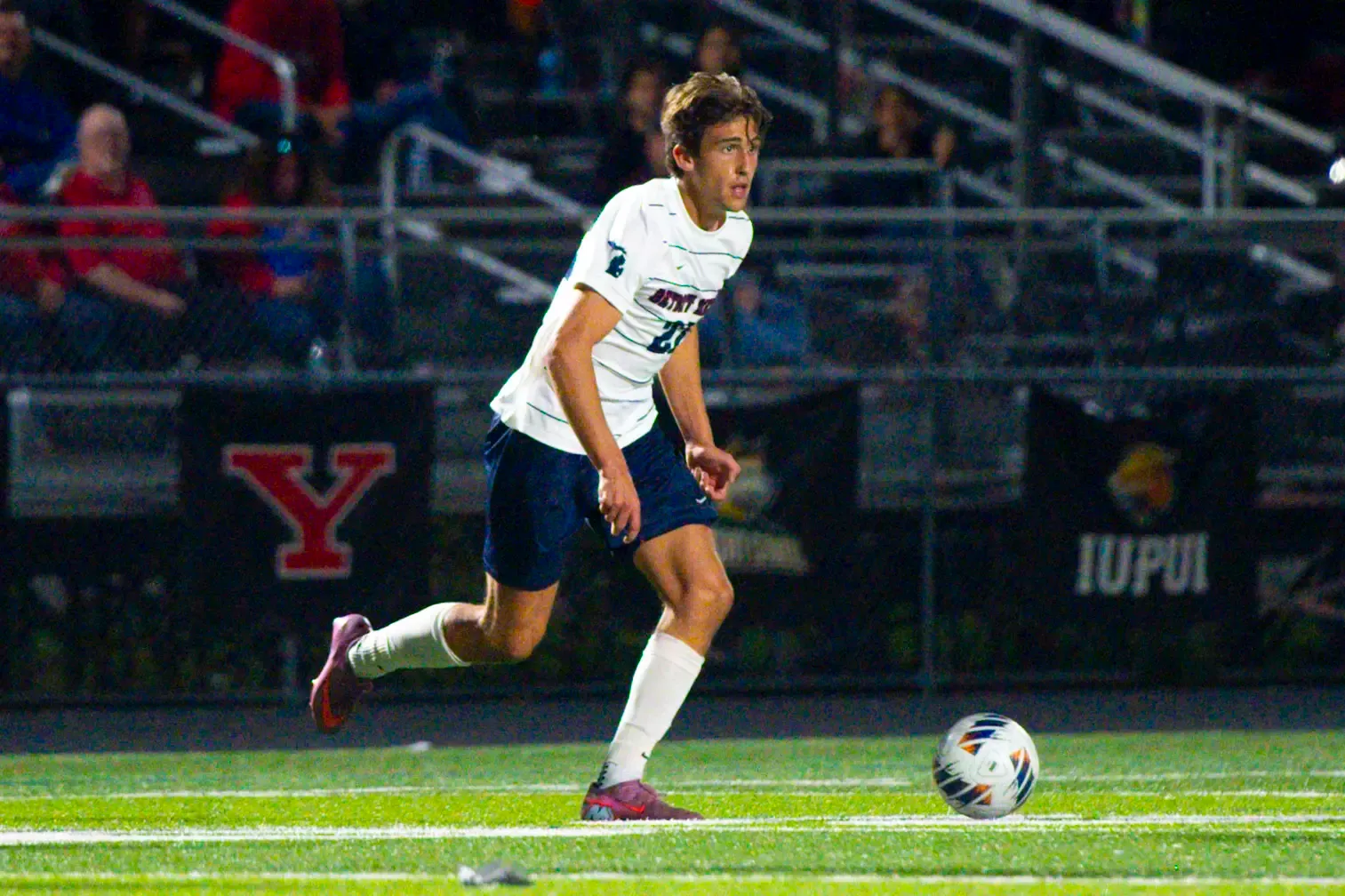 Johnny Strickler, sophomore midfielder, dribbles.
