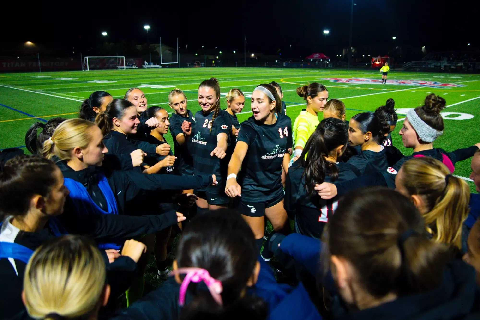 Leila Lanier, junior defense (14), addresses the team ahead of kickoff.