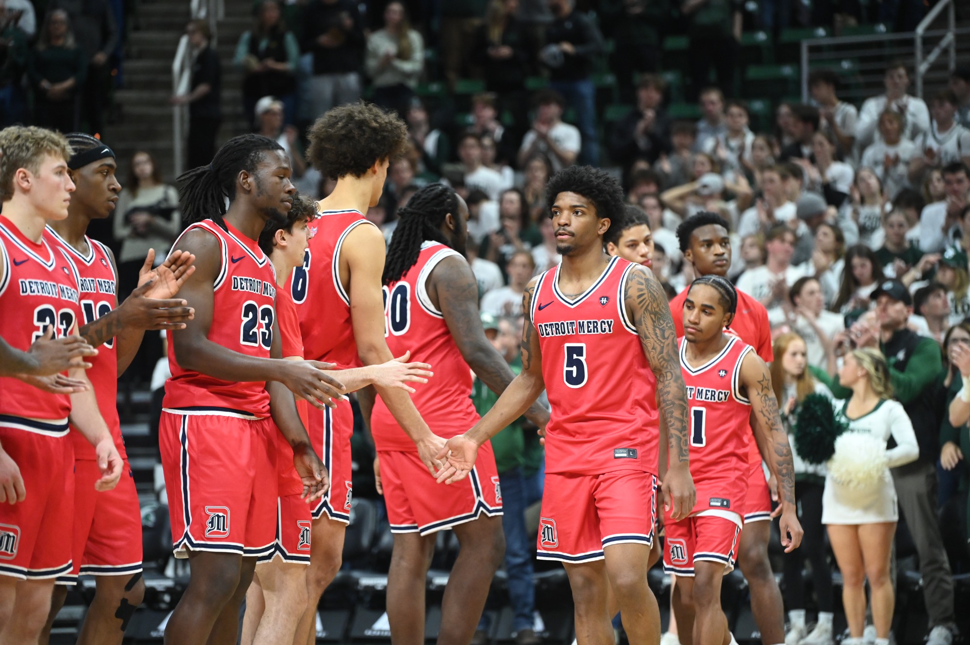 Orlando Lovejoy slaps hands in team line up