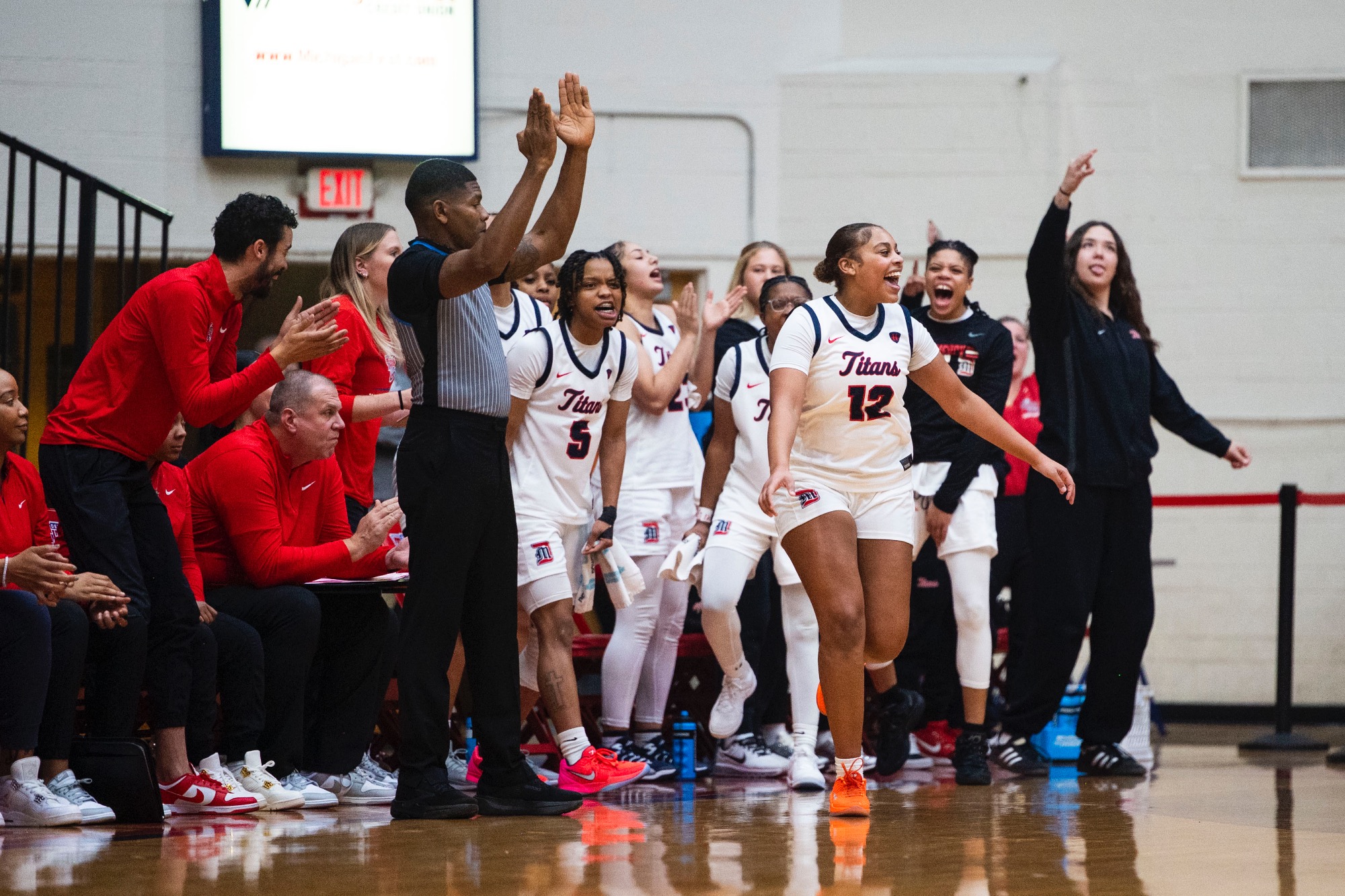 Amaya Burch, junior guard, celebrates after a three-point basket.