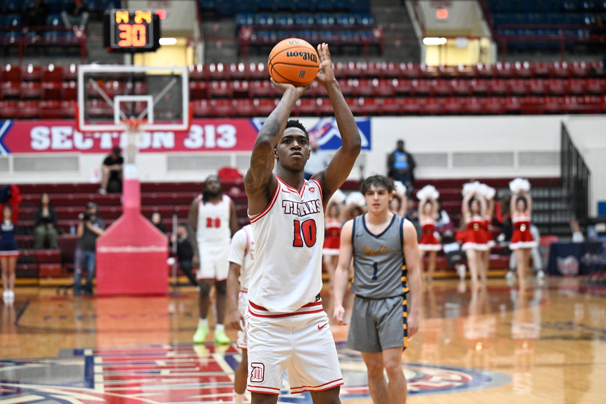 Detroit Mercy guard Nate Johnson (10) shoots a free throw in the second half against Siena Heights, Saturday, December 20, 2025, in Detroit.