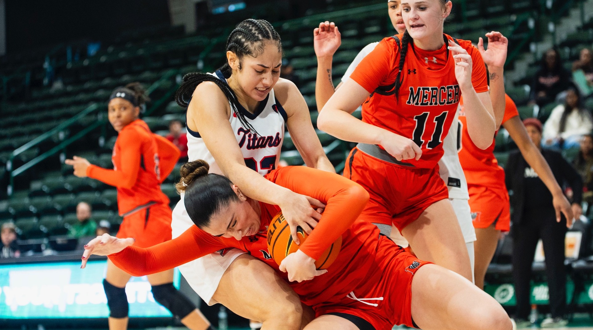 Jasmine Edwards tries to grab ball rom Mercer player