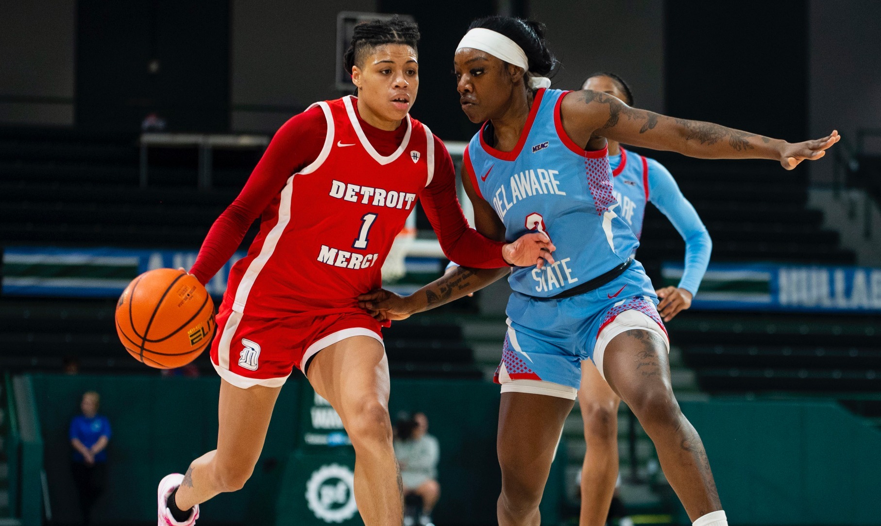 Aaliyah McQueen dribbles past a defender