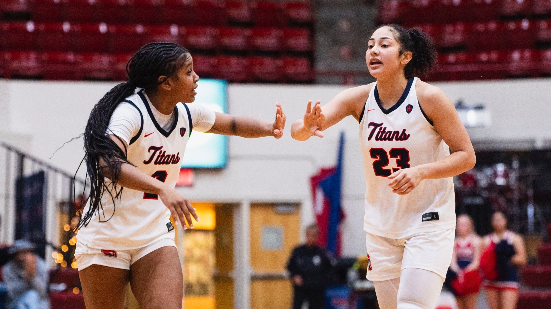 Makayla Jackson & Jasmine Edwards celebrate a shot vs IU Indy