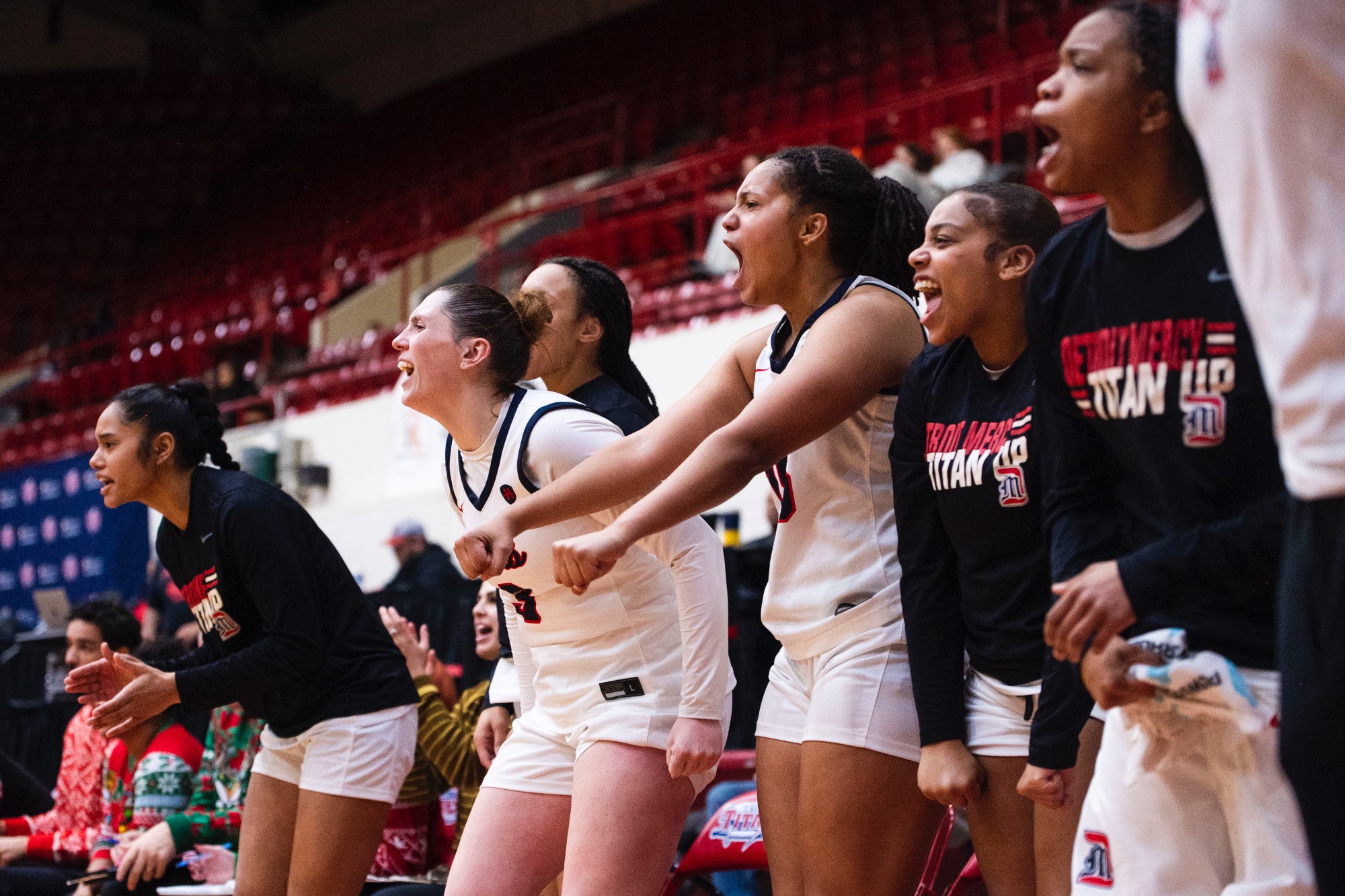 The Titans celebrate on the bench.