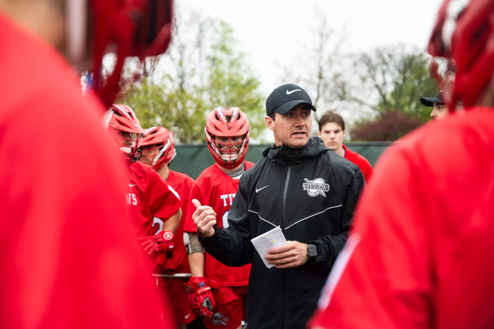 Head coach Charlie Hayes talks to team 
