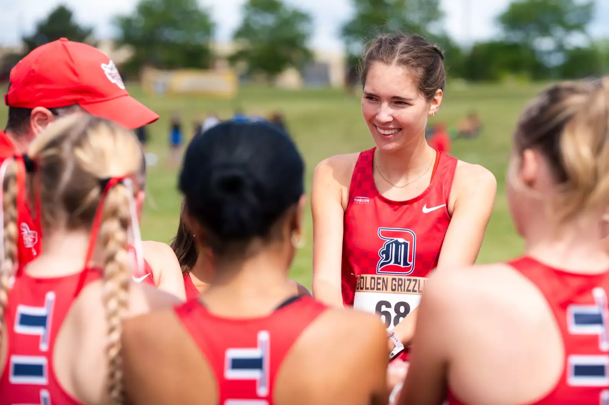 Claire Hunt in the pre-race huddle at Oakland