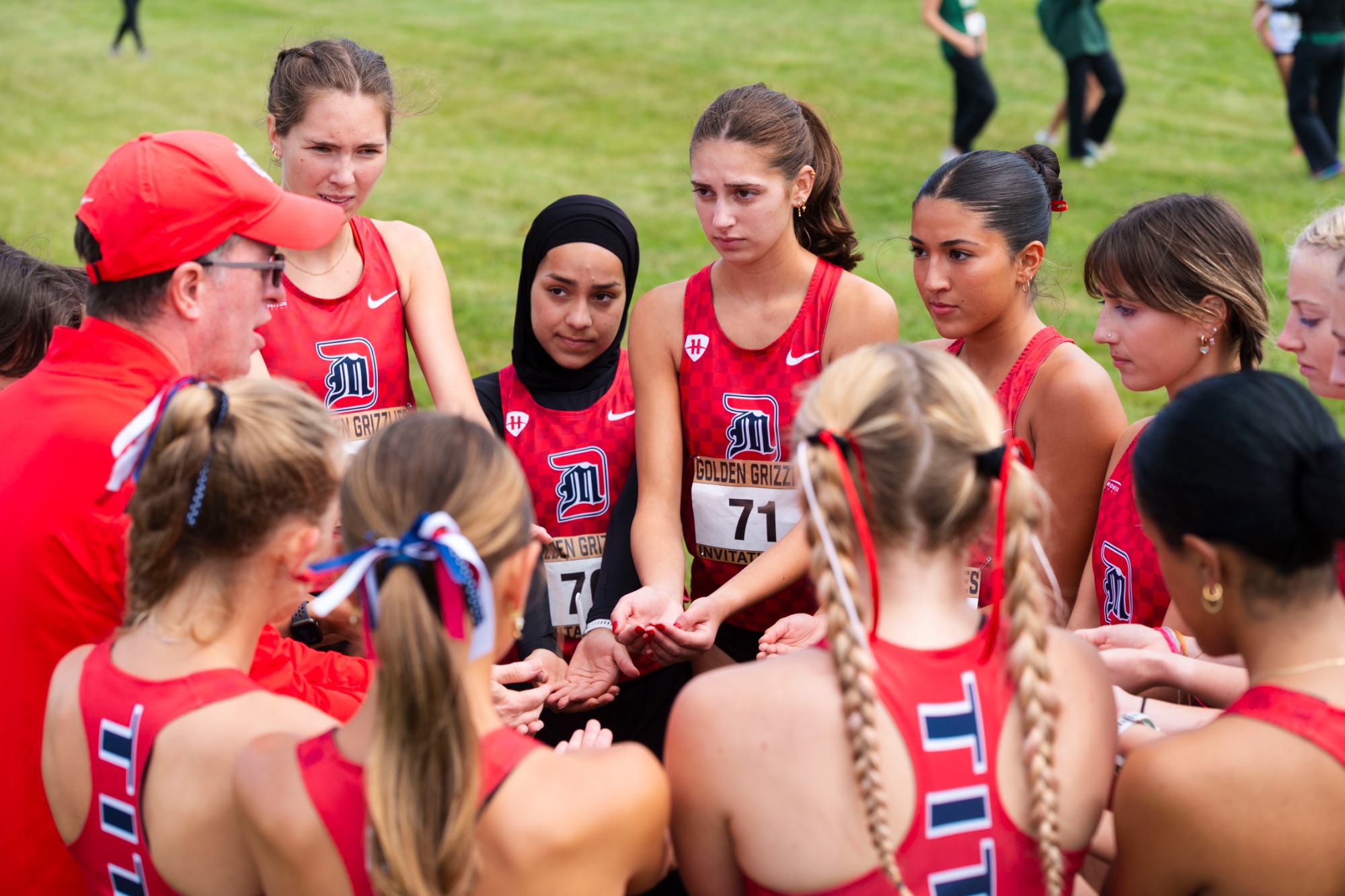Claire Hunt in the pre-race huddle at Oakland