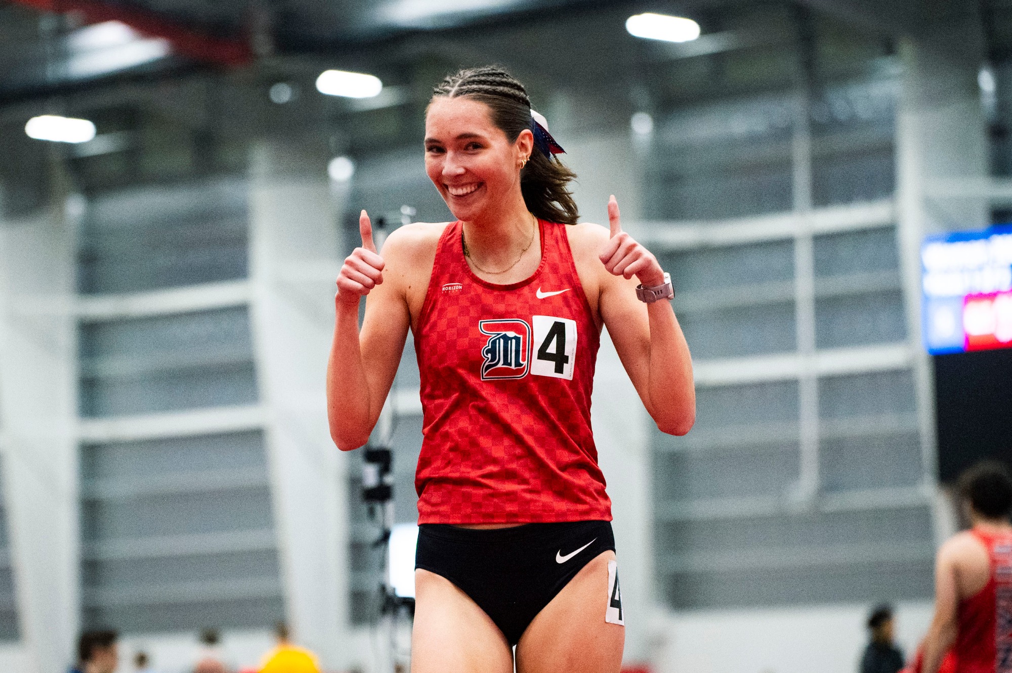 Claire Hunt celebrates winning the 3,000 meters
