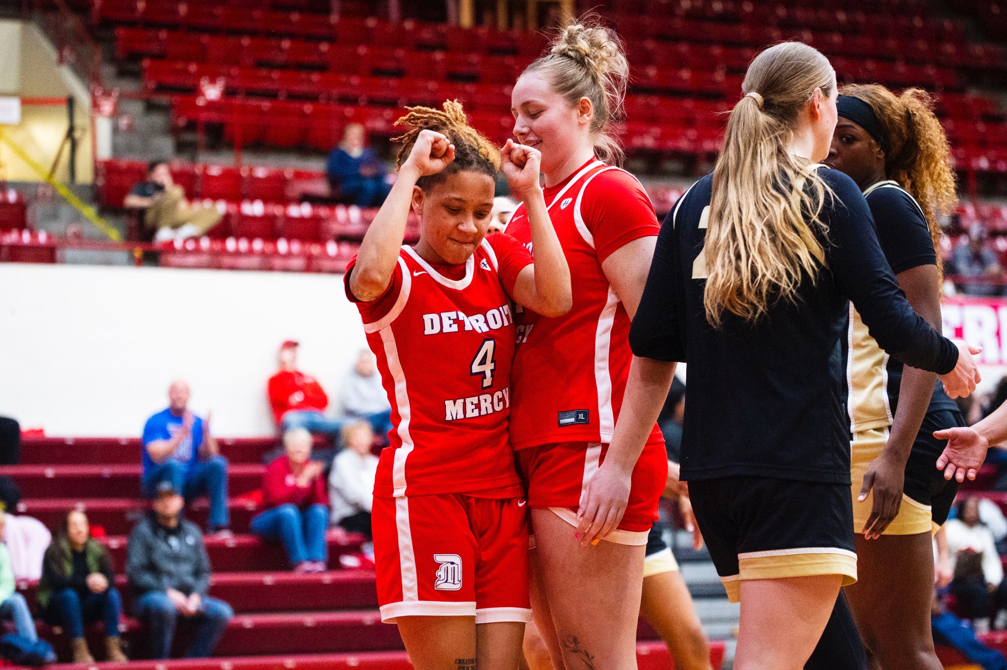 Myonna Hooper, senior guard (4), celebrates with Addisen Mastriano, sophomore center, after a tough basket.