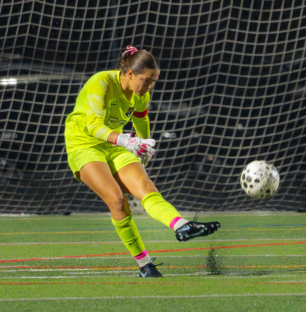Eva Hill kicking the ball