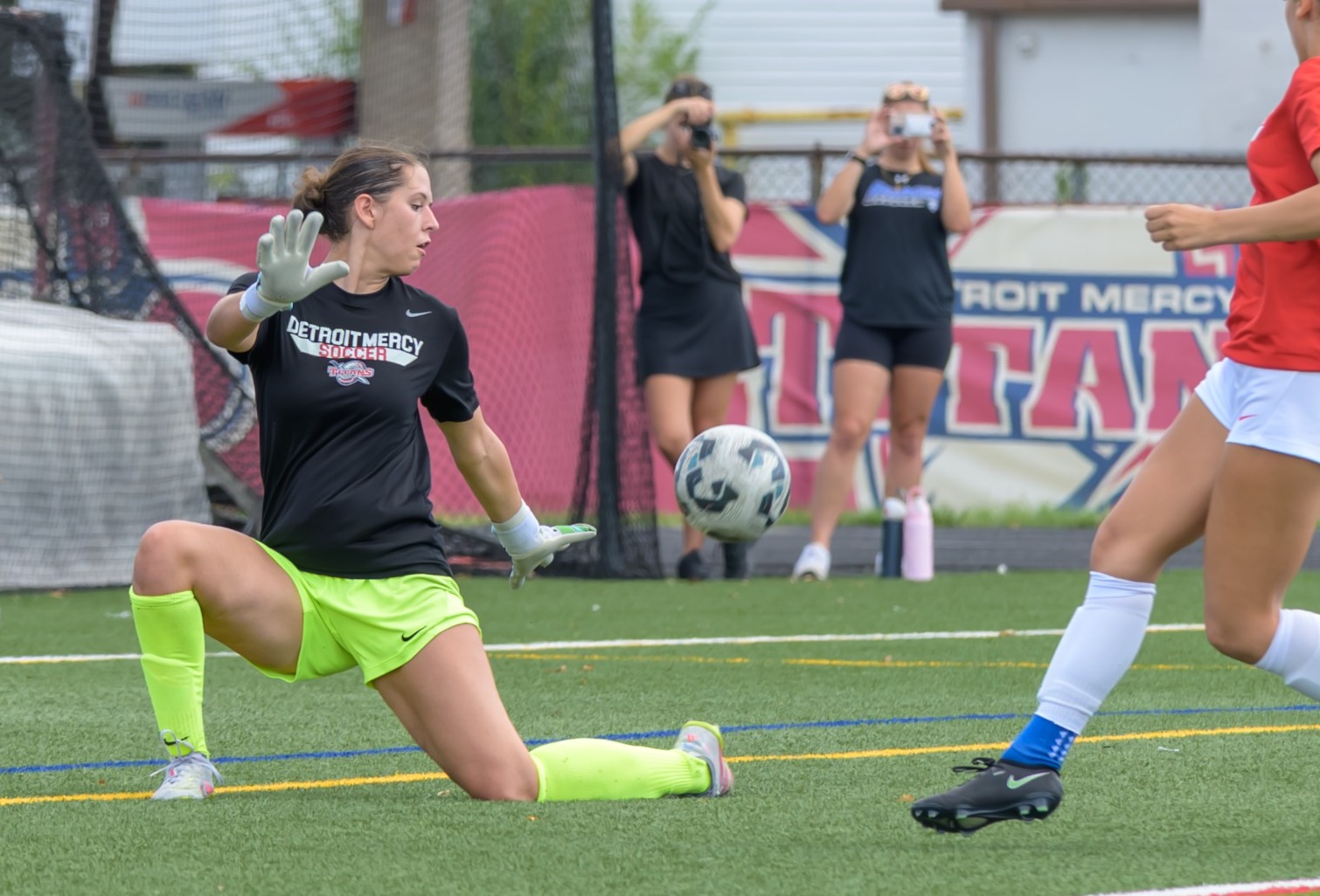 Evangeline Lulgjuraj makes a save in pre-game warm up