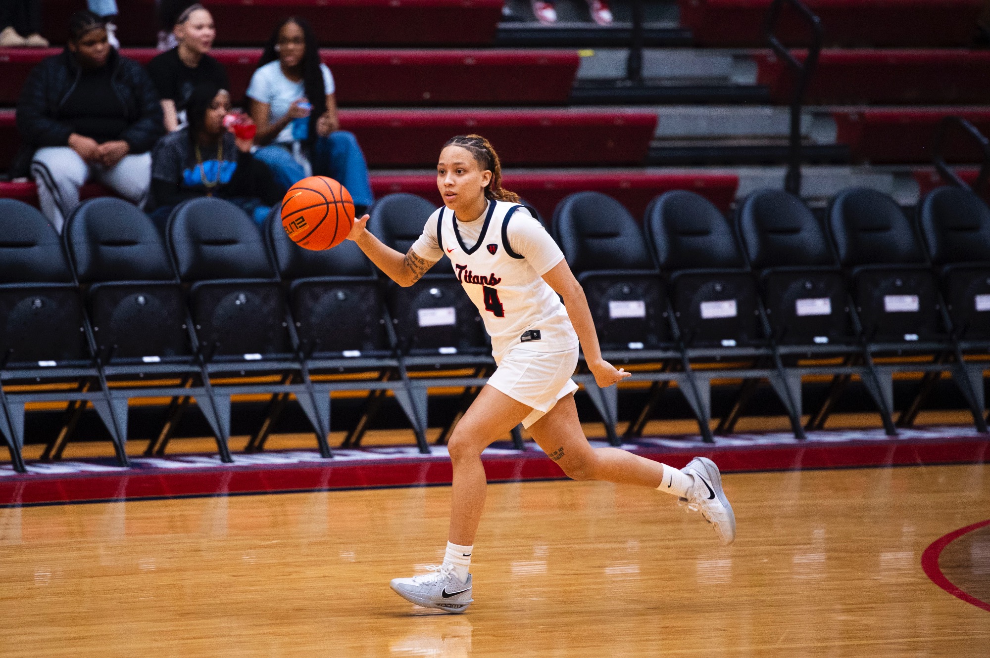 Myonna Hooper, senior guard, brings the ball up the floor.