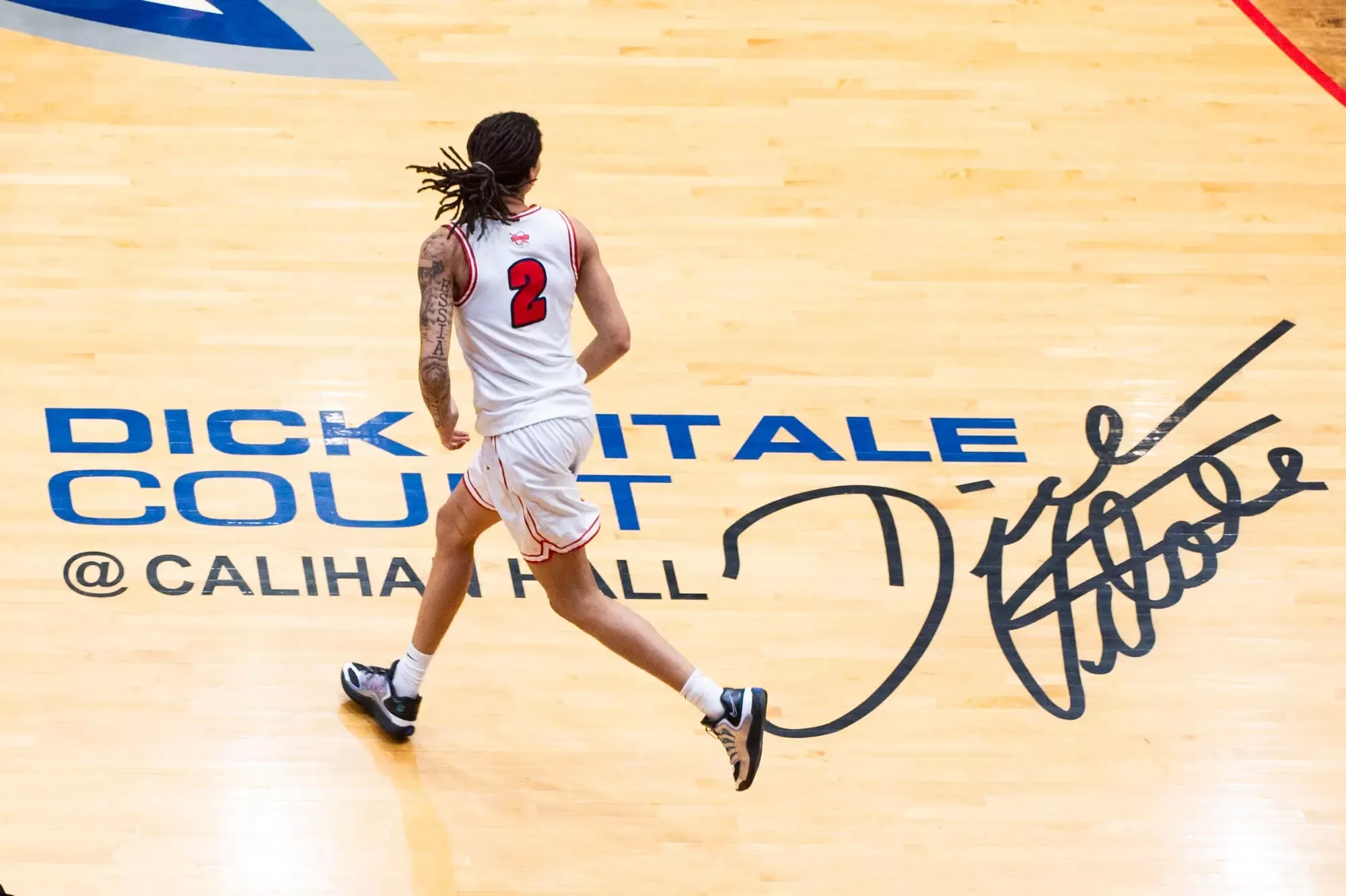 Je'kel Cotton on offense on Dick Vitale logo