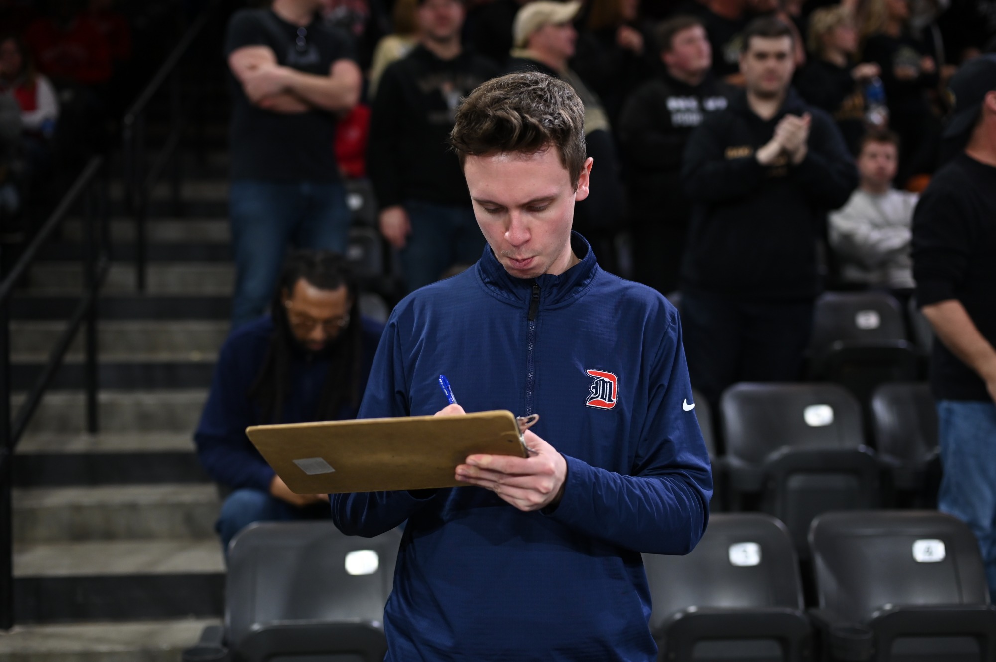 Graduate assistant AJ Bollis before the game 