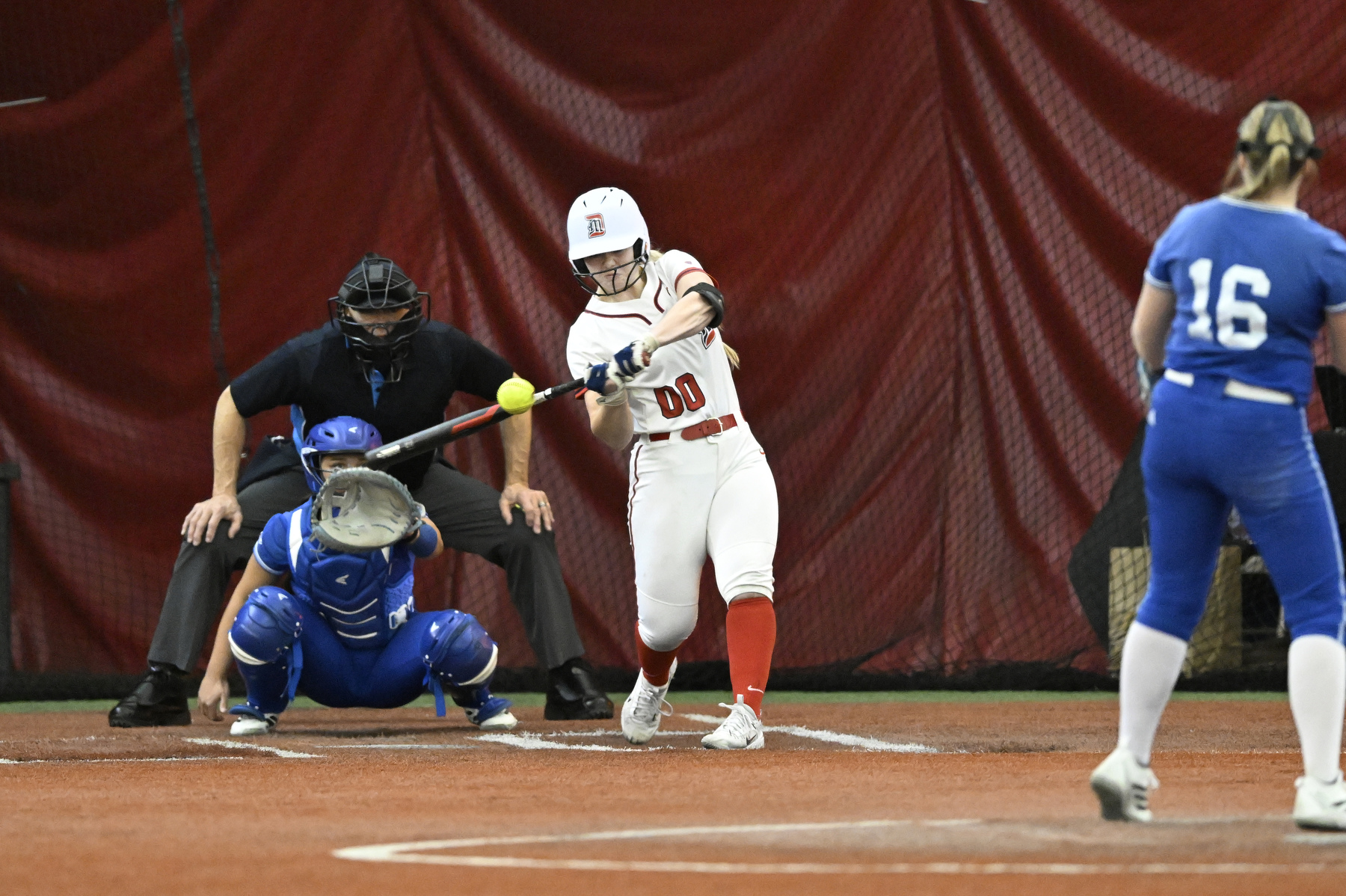 Detroit Mercy designated player Savannah Schultz hits a home run against Drake University, Friday, February 6, 2025, at The Dome at the Parkway Bank Sports Complex in Rosemont, IL.
